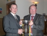 Danny McLernon presents Football Captain Thomas Doherty the All County Division Two League Trophy